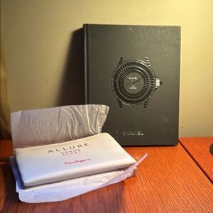 Chanel coffee table book plus a pouch